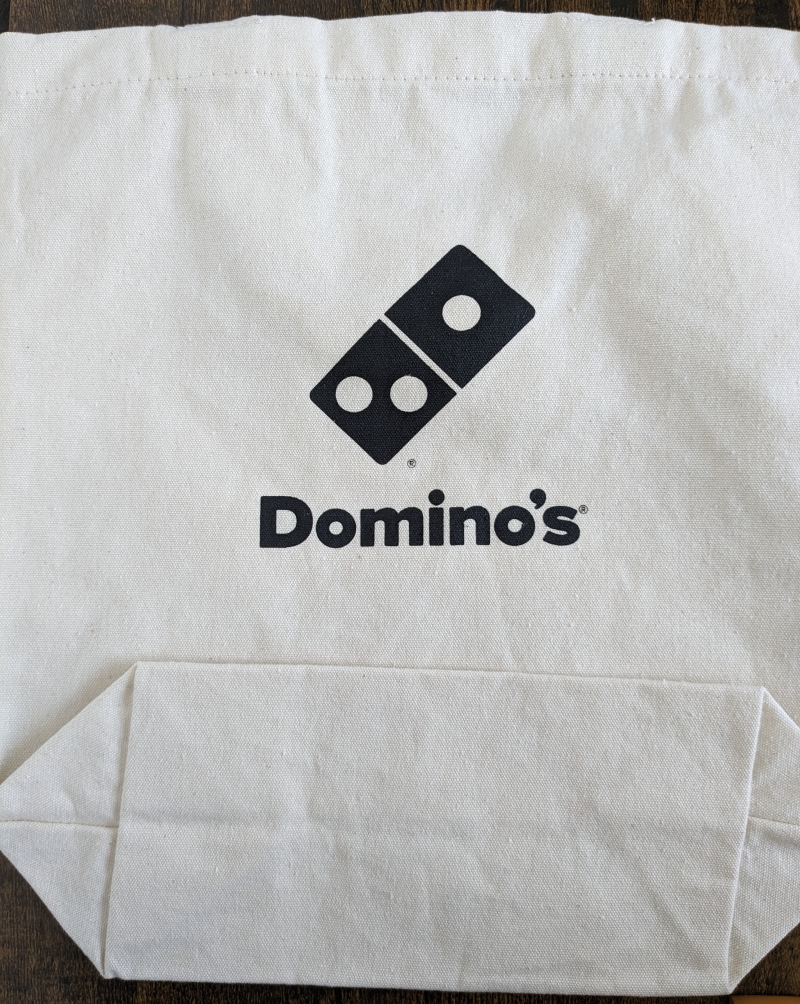 ドミノピザ福袋 オリジナル「トートバック」表：ドミノピザのロゴ